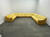Eine gelbe Couch die um zwei Ecken geht und so den ganzen großen sonst leeren Raum mit weißen Wänden fast ausfüllt. Valerio Nicolai, Nuova Carboneria, 2023. Clima Milano. Liste Art Fair
