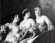 Three young women with instruments and a songbook (1915)
