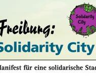 Freiburg: Solidarity City das Logo - ein violetter Kreis mit grünen Häusern aus der Froschperspektive