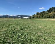 Glider plane taking off from ground level